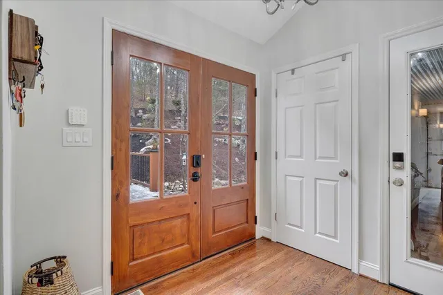 a living room with furniture a couch and wooden floor
