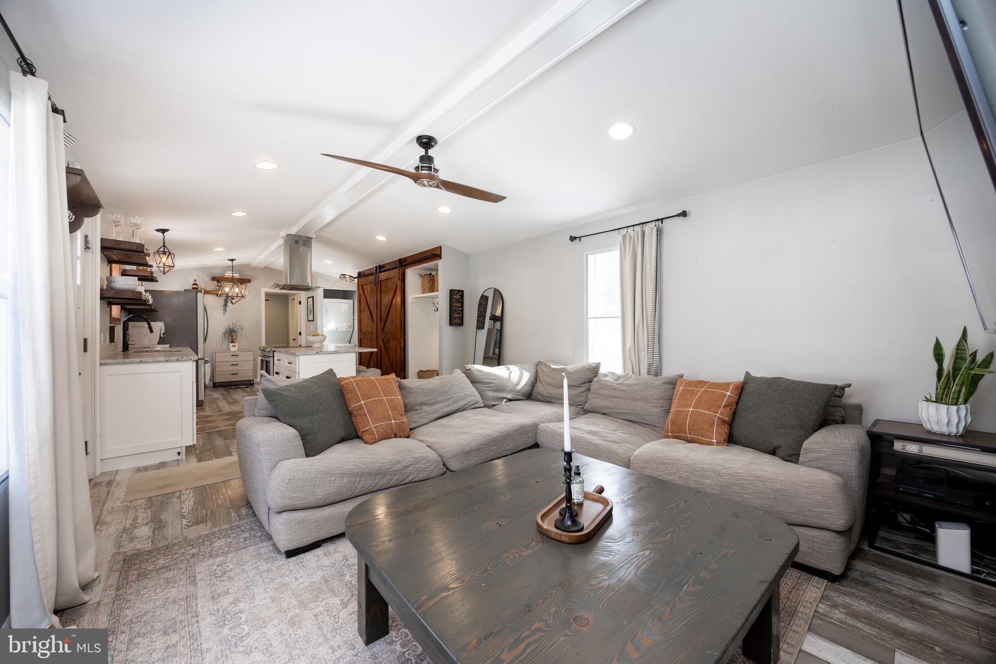 1524 Jonathan Road West Chester, PA 19380 - Photo 12 of 26 a living room with furniture kitchen view and a chandelier