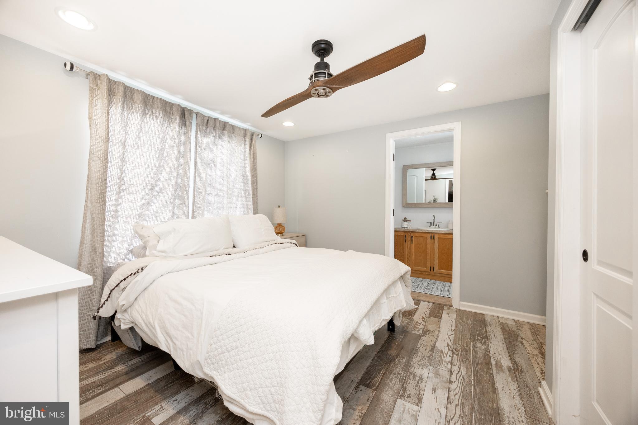 1524 Jonathan Road West Chester, PA 19380 - Photo 13 of 26 a bedroom with a bed and a dresser