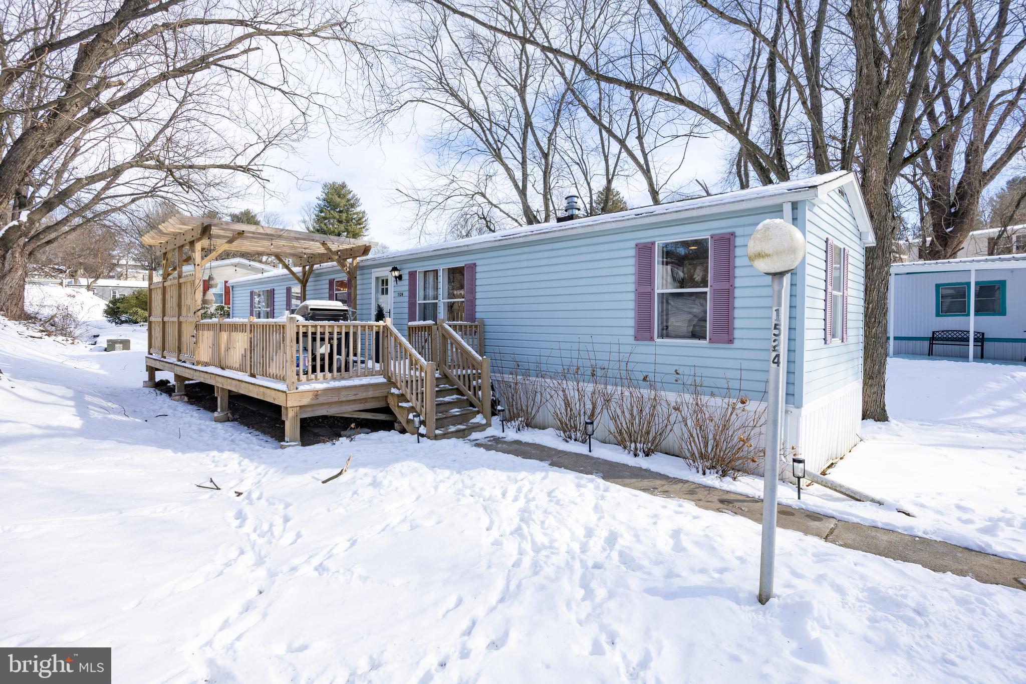 1524 Jonathan Road West Chester, PA 19380 - Photo 24 of 26 a view of a house with a yard covered in snow