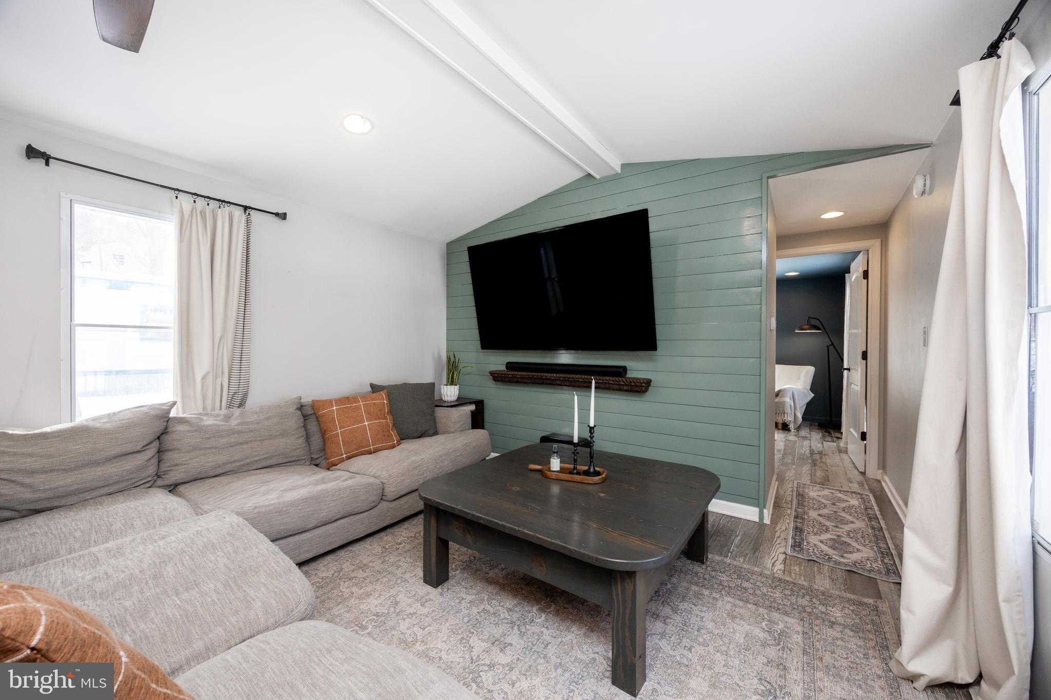 1524 Jonathan Road West Chester, PA 19380 - Photo 4 of 26 a living room with furniture and a flat screen tv