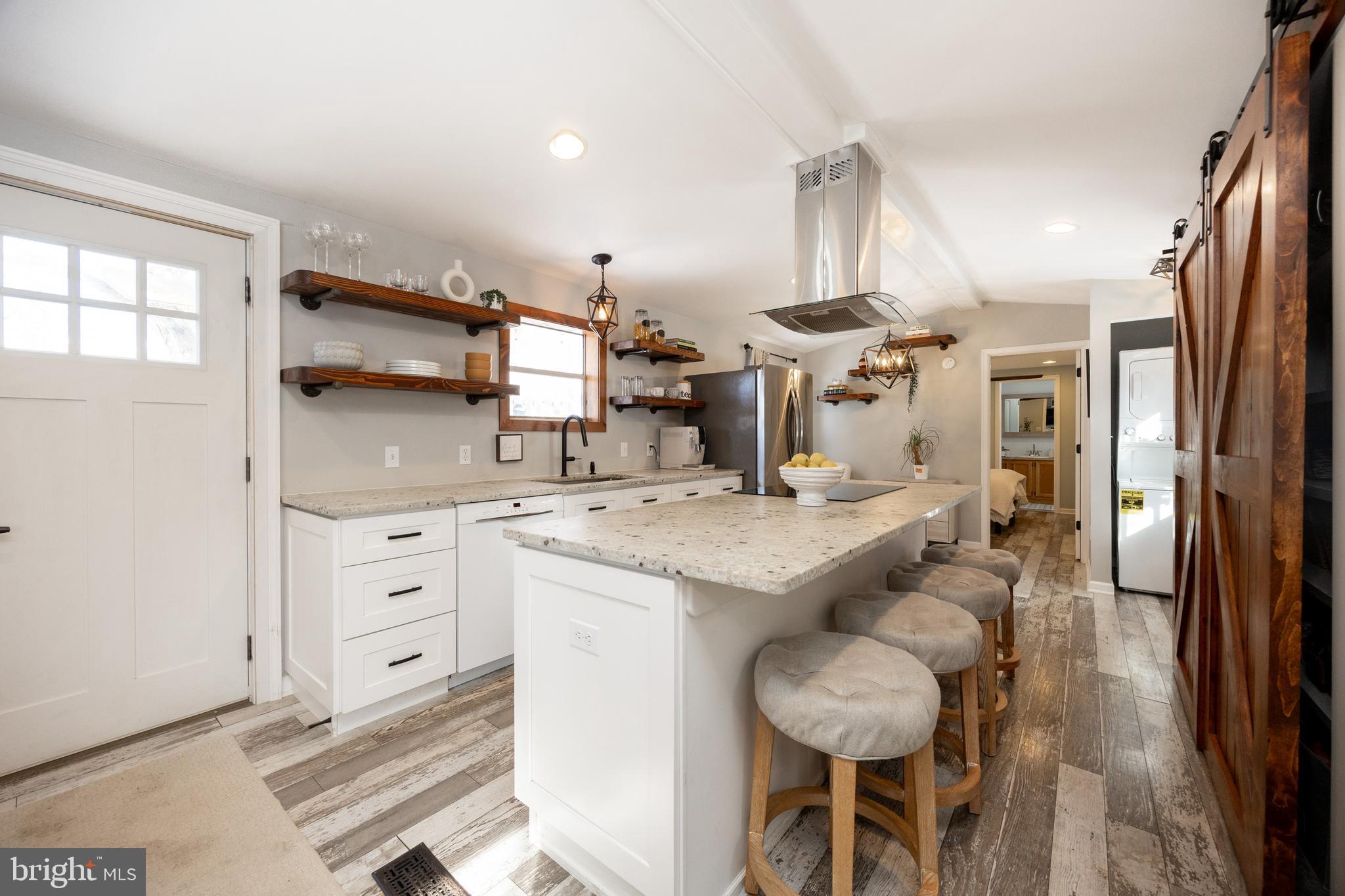 1524 Jonathan Road West Chester, PA 19380 - Photo 7 of 26 a kitchen with granite countertop a sink cabinets and stainless steel appliances