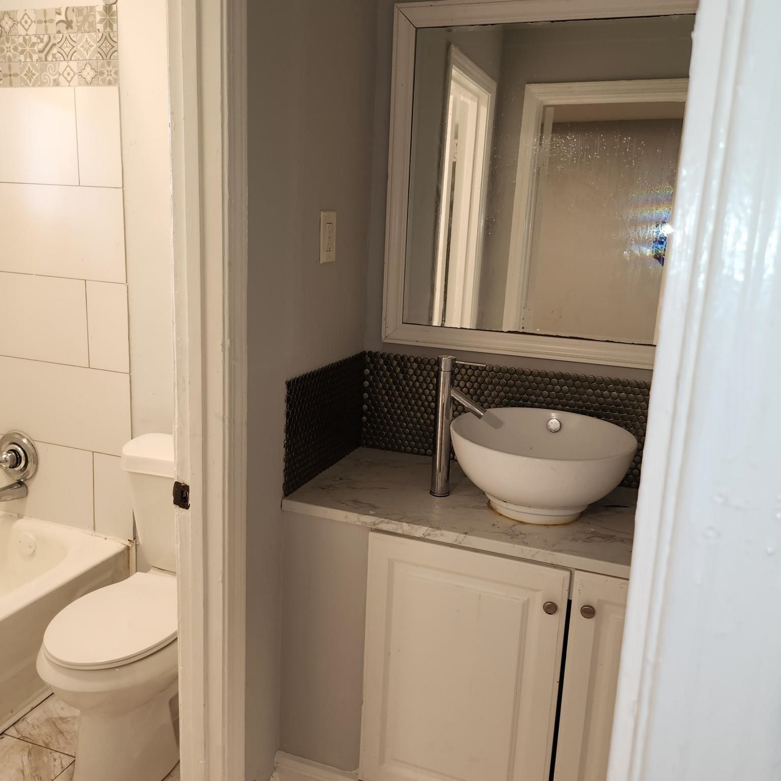 1220 Nora Road Memphis, TN 38109 - Photo 8 of 15 a bathroom with a granite countertop sink and a toilet