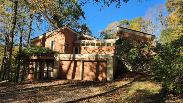 a view of a house with large windows
