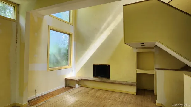 a living room with a bed and furniture