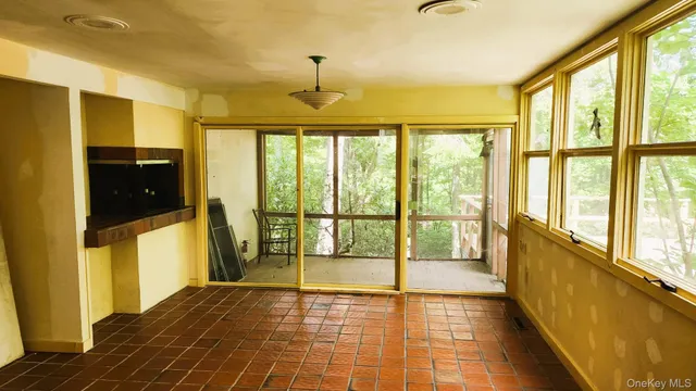 a view of an empty room with a window