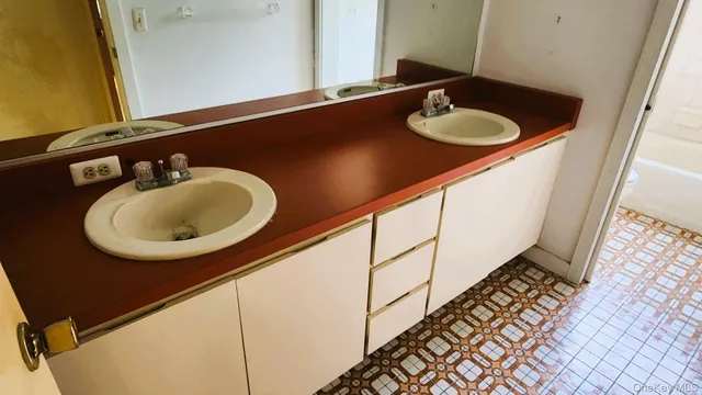 a bathroom with a sink and a mirror