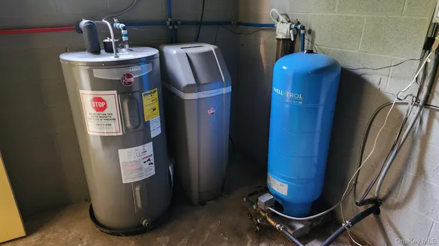 a view of storage and utility room with washer and dryer