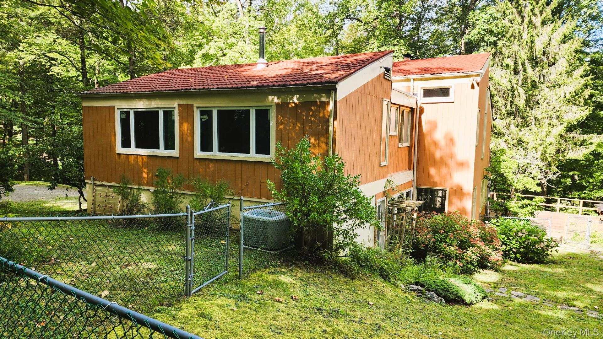 402 Hortontown Road Hopewell Junction, NY 12533 - Photo 4 of 29 a front view of a house with a yard