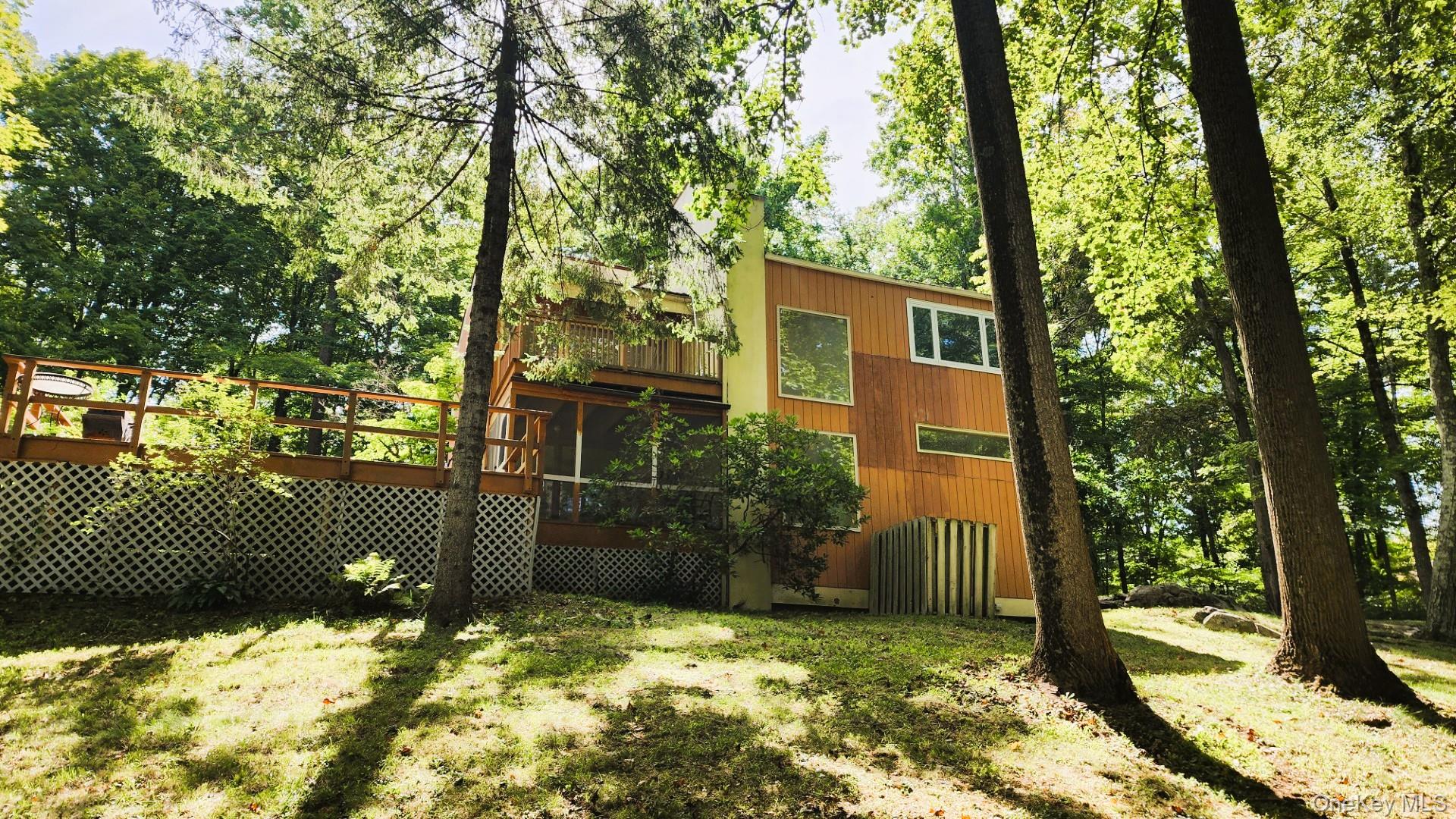 402 Hortontown Road Hopewell Junction, NY 12533 - Photo 8 of 29 a view of a yard with large tree and wooden fence