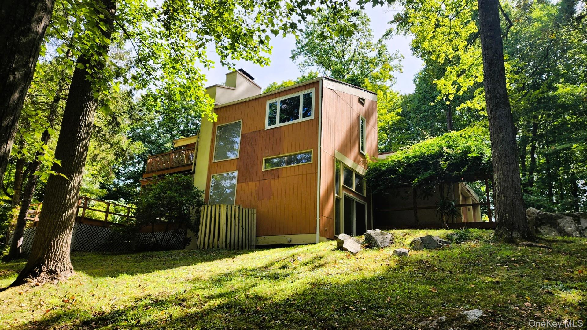 402 Hortontown Road Hopewell Junction, NY 12533 - Photo 9 of 29 a backyard of a house with large trees