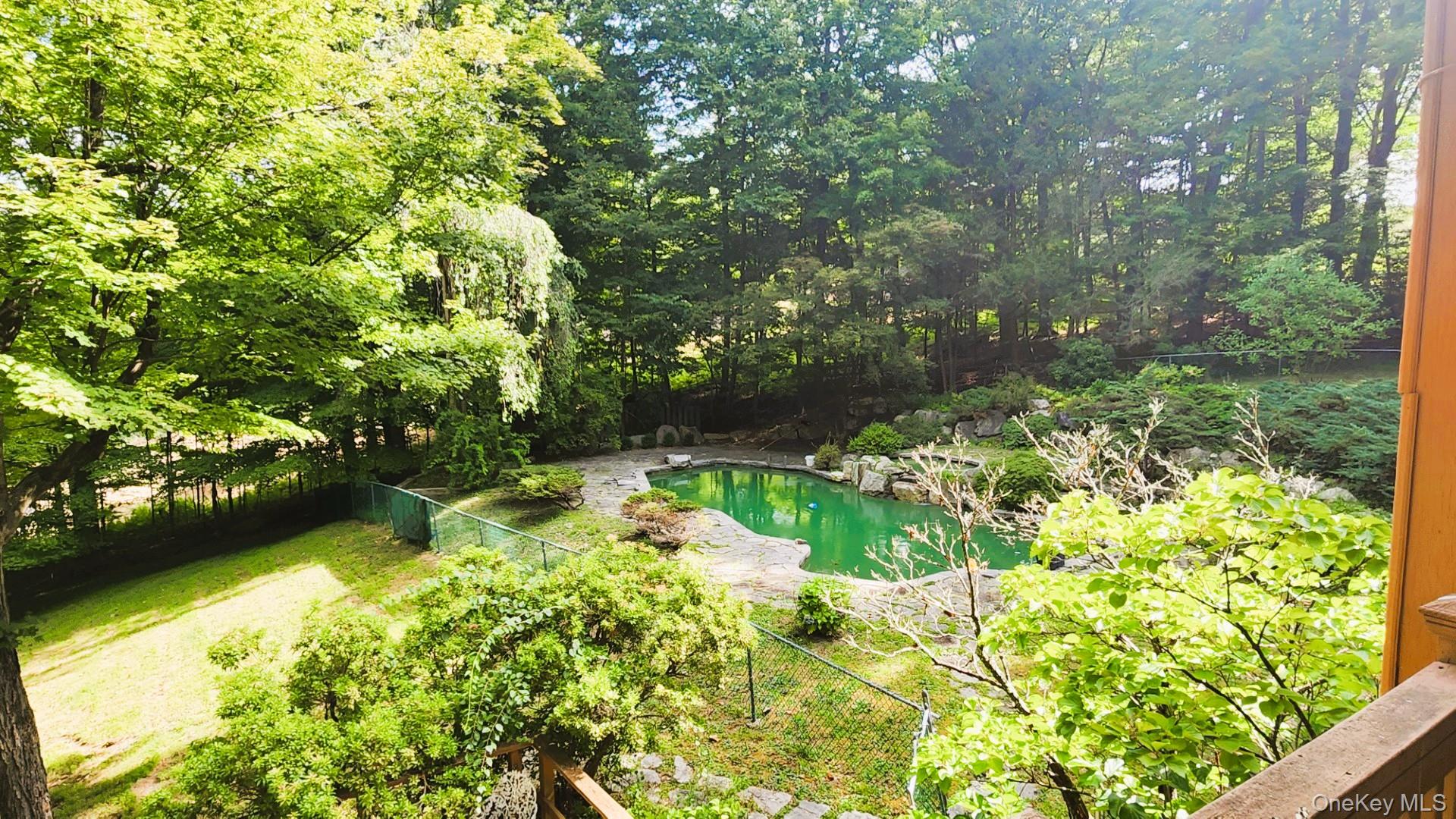 402 Hortontown Road Hopewell Junction, NY 12533 - Photo 10 of 29 a backyard of a house with a yard and potted plants