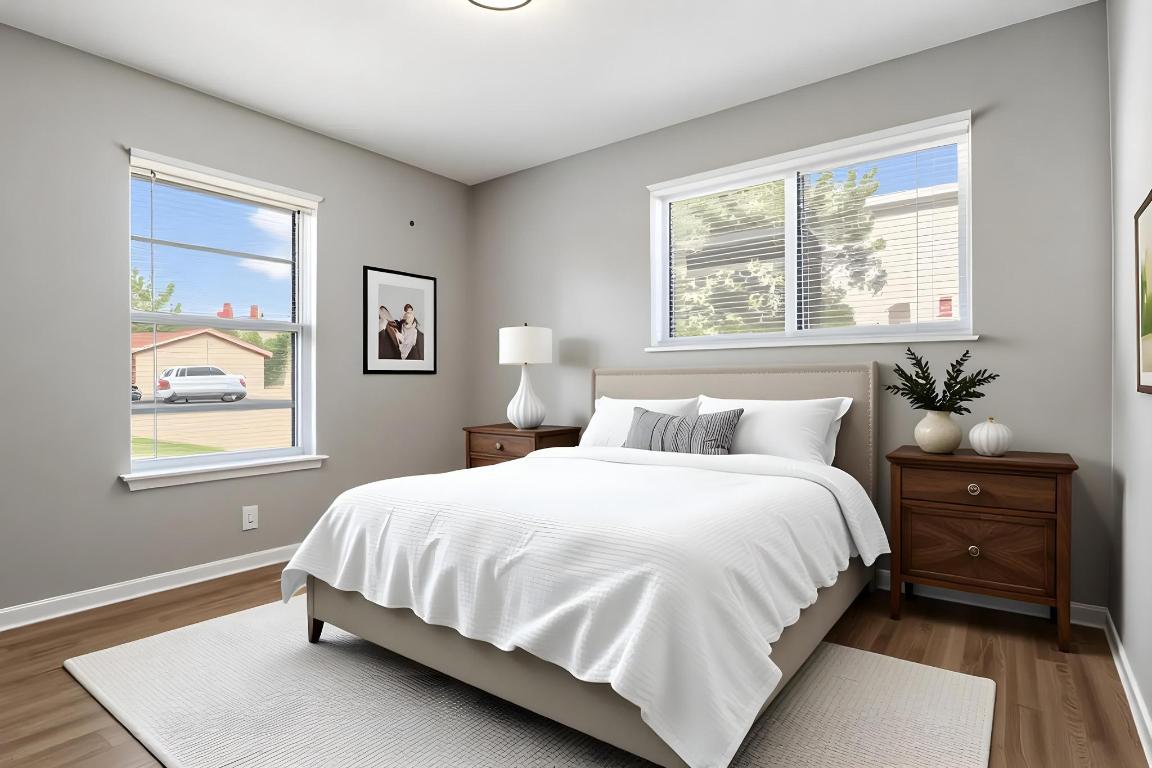 2405 Parker Circle, Unit B Georgetown, TX 78628 - Photo 11 of 23 Virtually Staged-Bedroom featuring multiple windows and wood finished floors