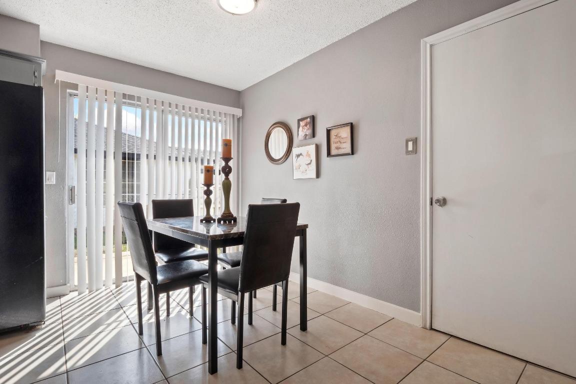2405 Parker Circle, Unit B Georgetown, TX 78628 - Photo 18 of 23 Dining room with a textured ceiling and light tile patterned floors