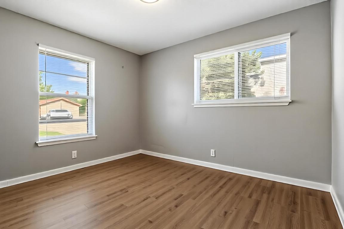 2405 Parker Circle, Unit B Georgetown, TX 78628 - Photo 10 of 23 Spare room featuring dark wood-type flooring and plenty of natural light