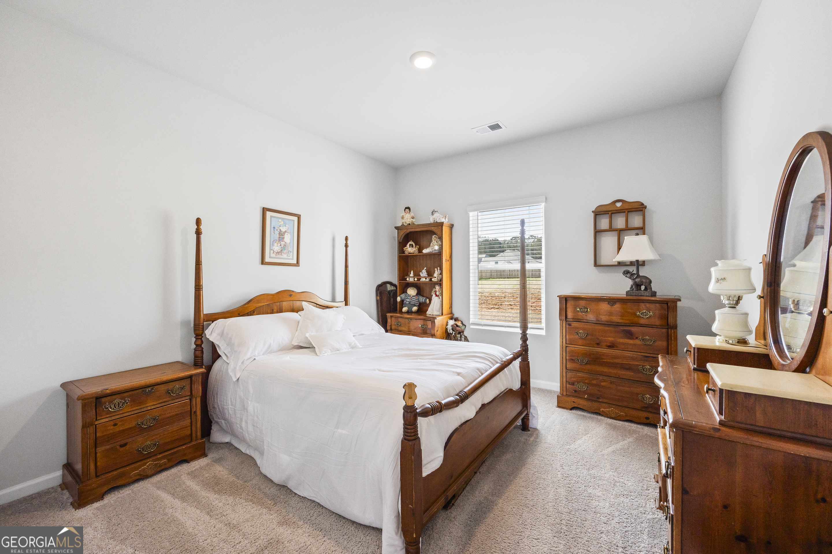 1064 Emmas Path Monroe, GA 30656 - Photo 11 of 55 a bed room with a bed and a tv