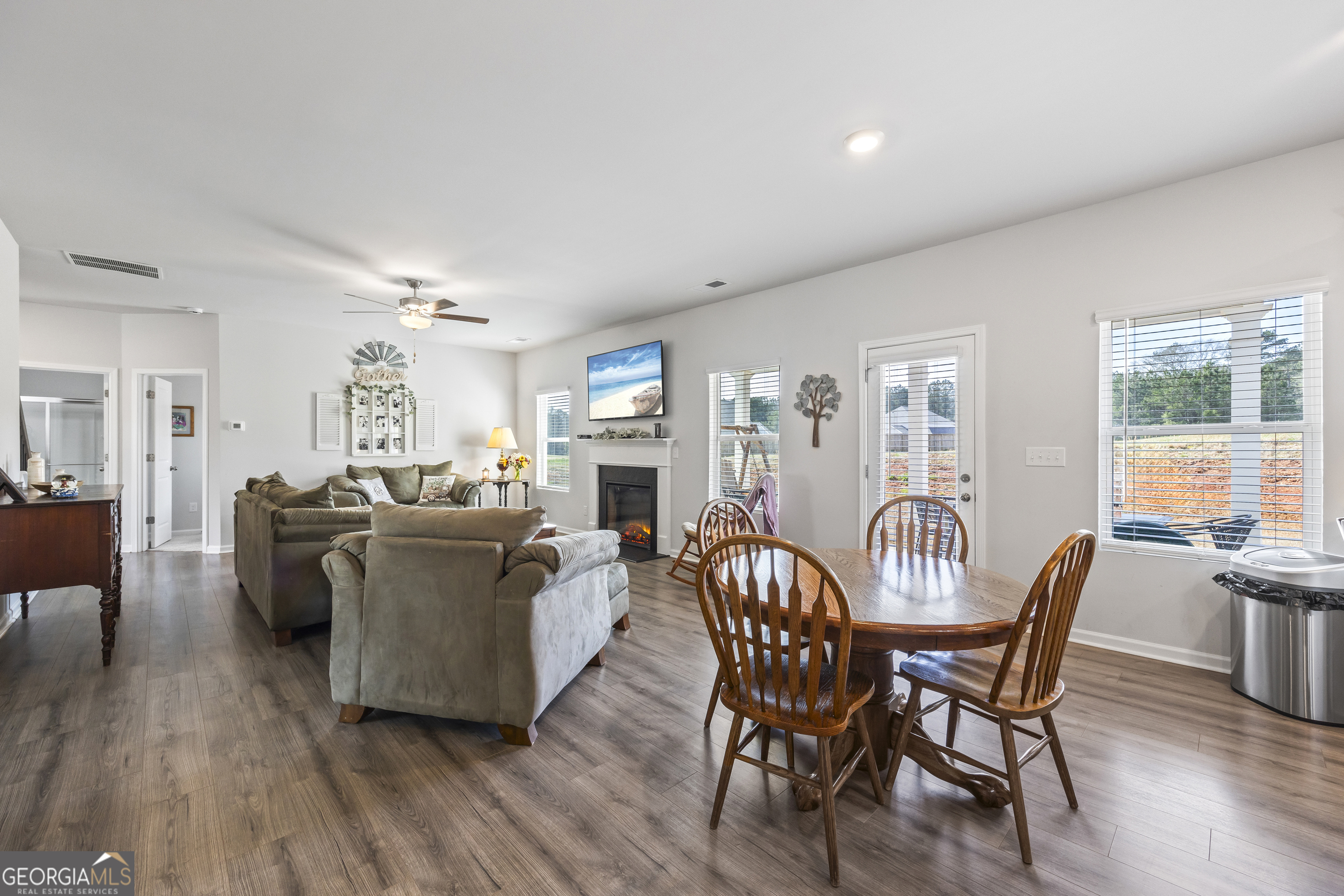 1064 Emmas Path Monroe, GA 30656 - Photo 18 of 55 a dining room with furniture and wooden floor