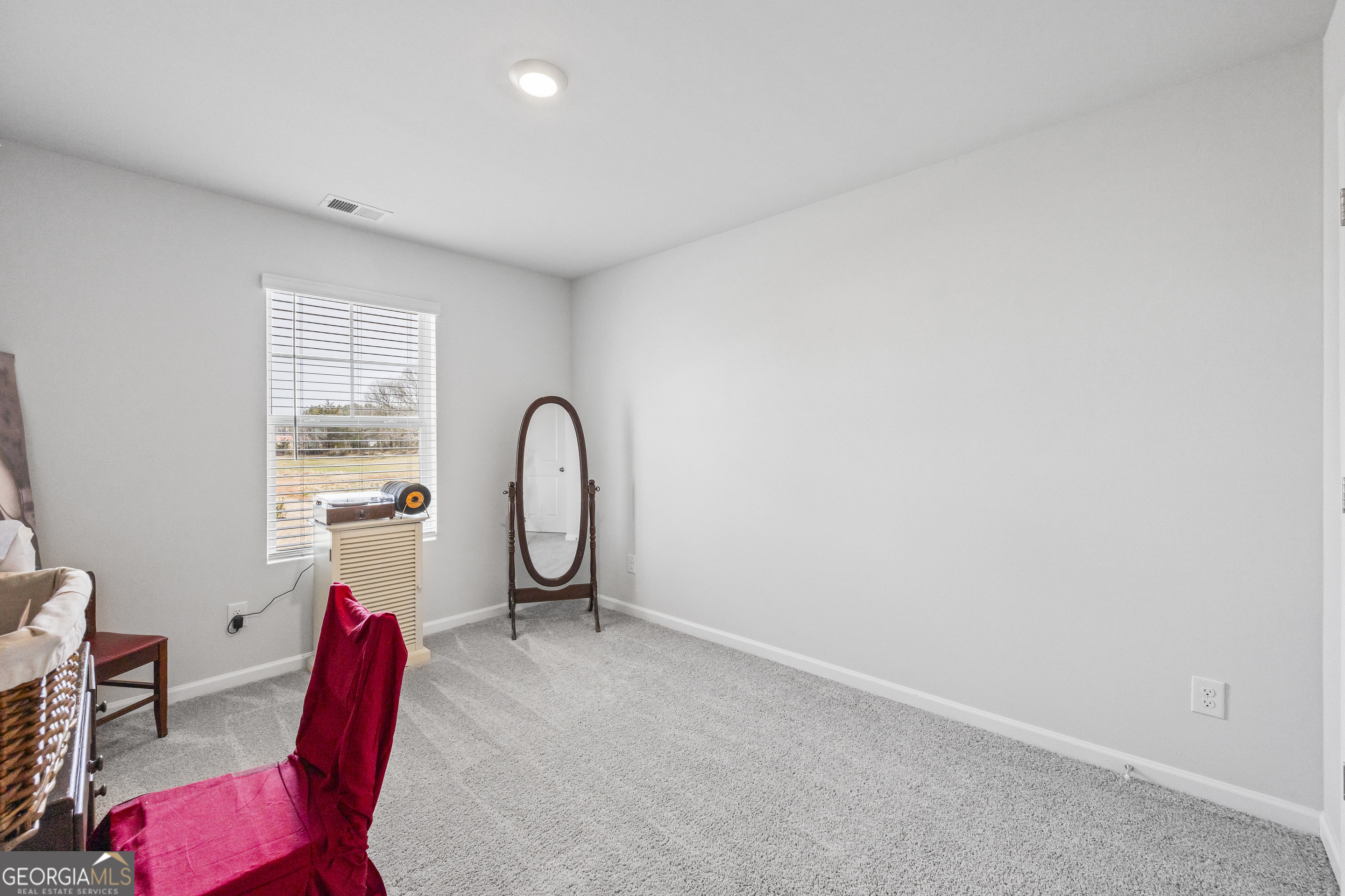 1064 Emmas Path Monroe, GA 30656 - Photo 23 of 55 a living room with furniture
