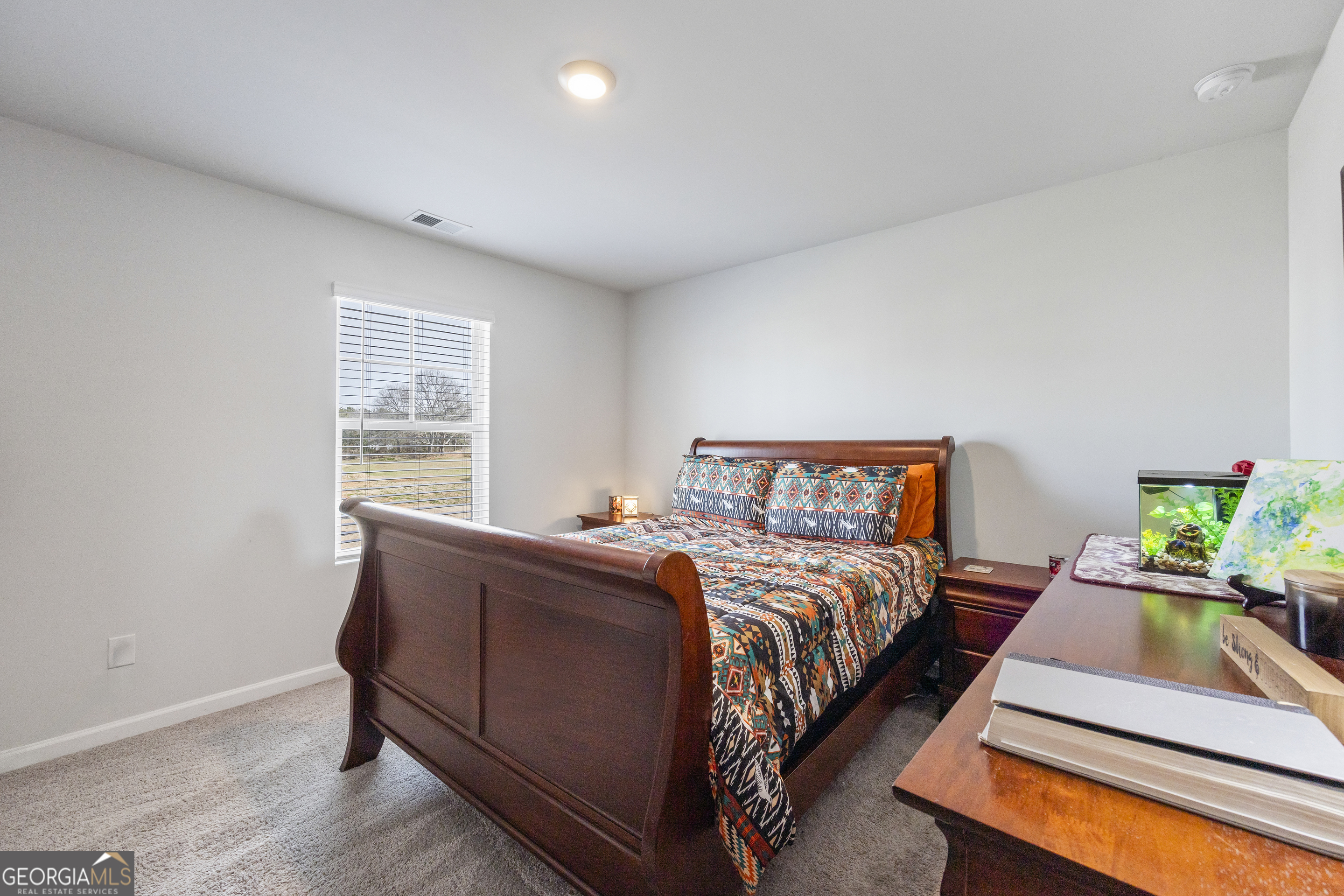 1064 Emmas Path Monroe, GA 30656 - Photo 30 of 55 a bed room with bed and window