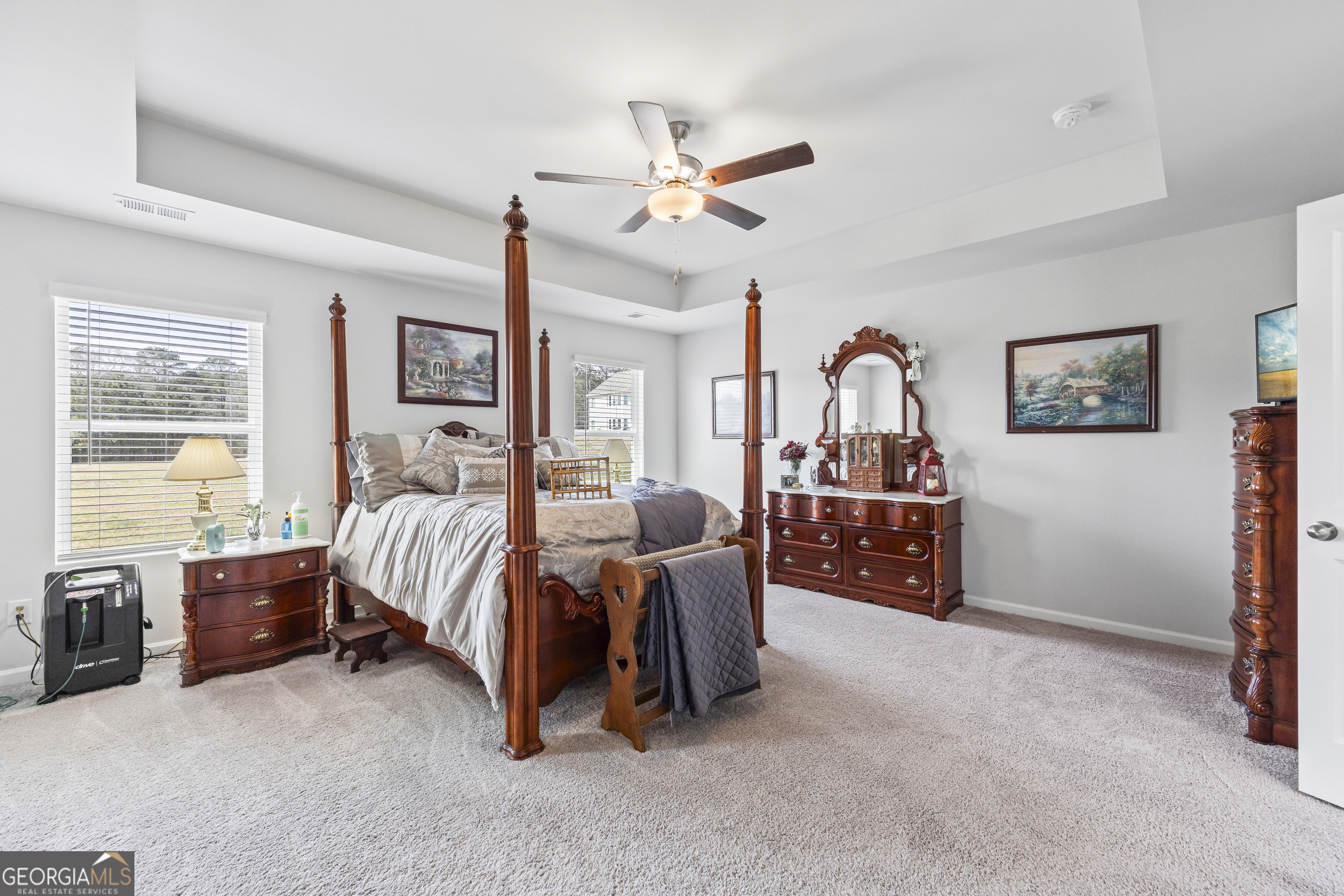 1064 Emmas Path Monroe, GA 30656 - Photo 32 of 55 a bed room with furniture and a ceiling fan