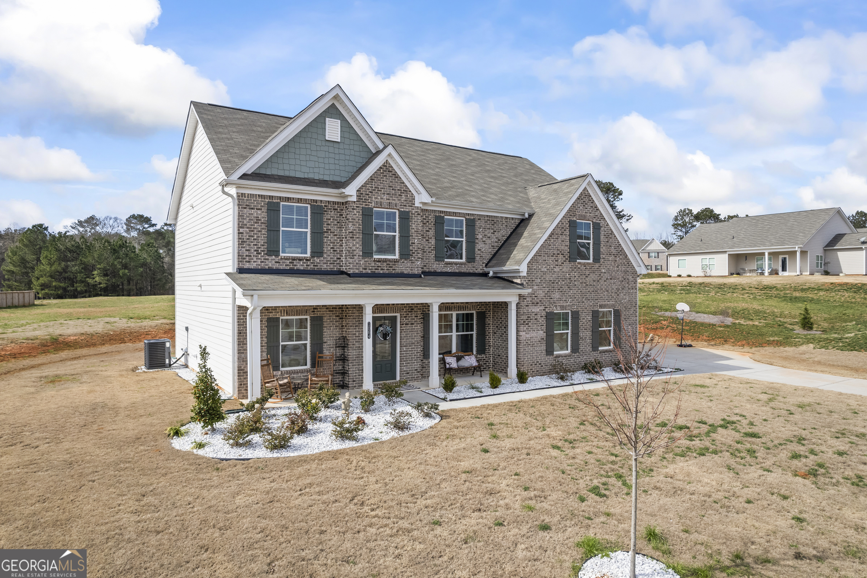 1064 Emmas Path Monroe, GA 30656 - Photo 4 of 55 a front view of a house with a yard