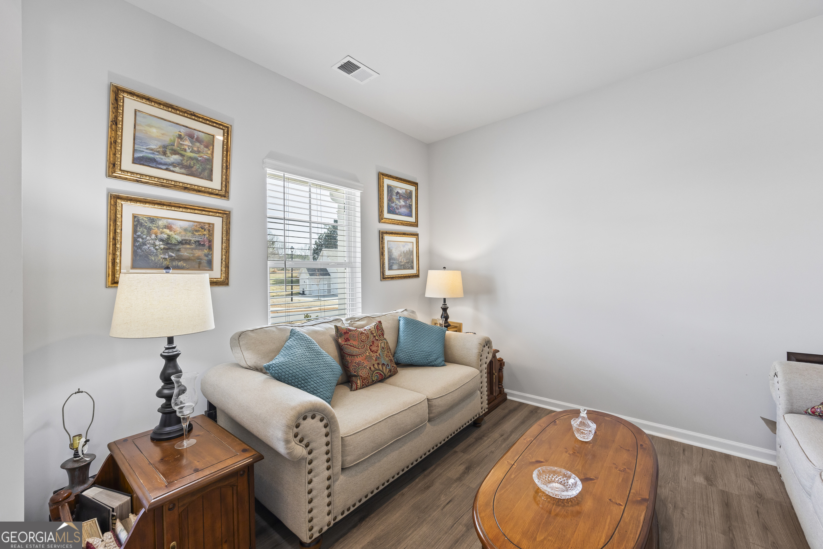1064 Emmas Path Monroe, GA 30656 - Photo 7 of 55 a living room with furniture and a window
