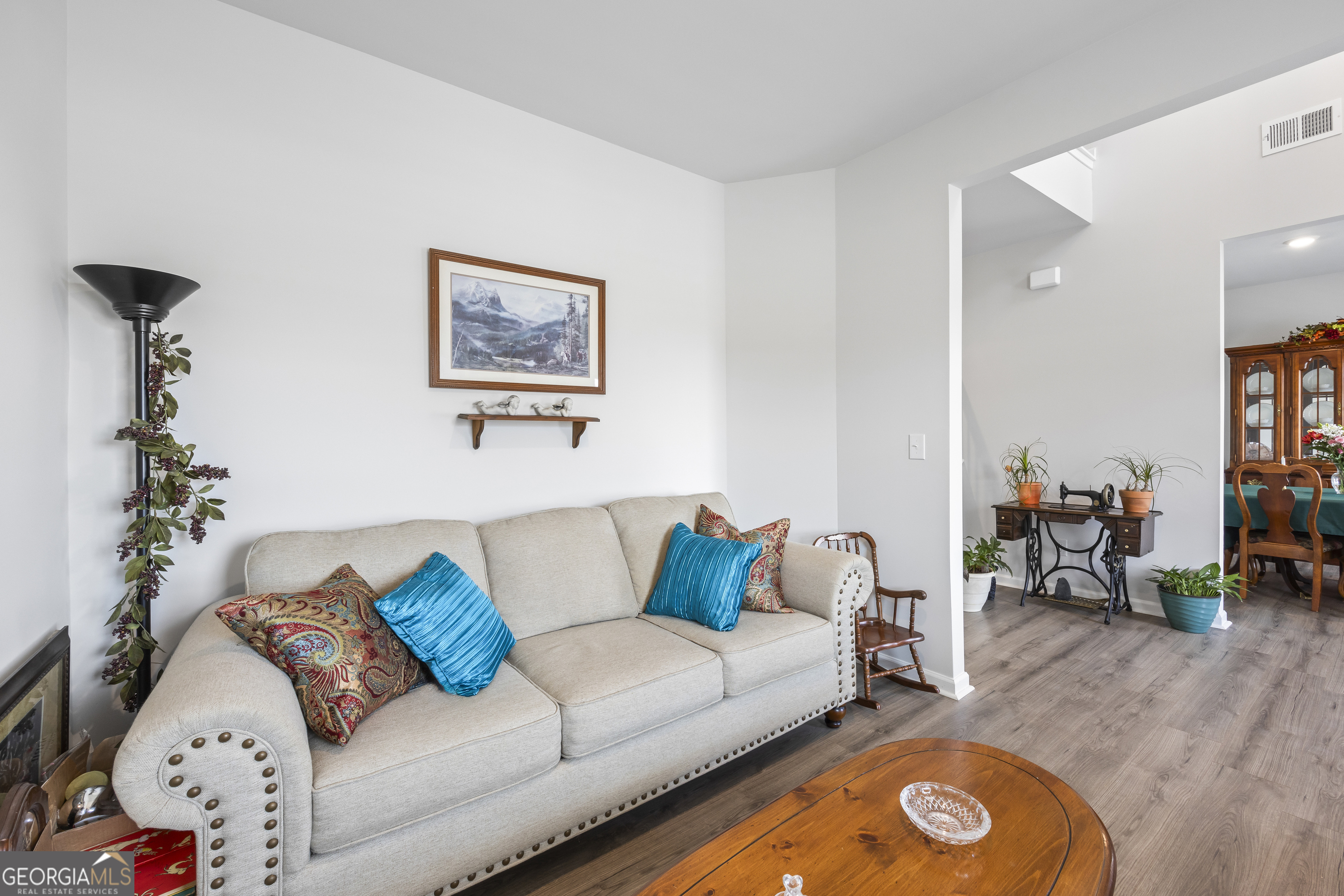 1064 Emmas Path Monroe, GA 30656 - Photo 8 of 55 a living room with furniture and wooden floor