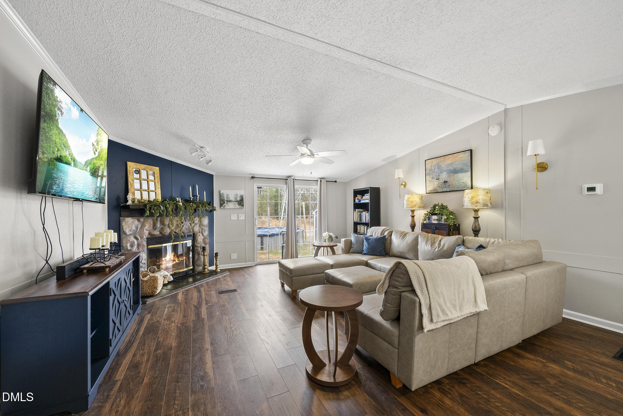 4703 Trinity Lane Rougemont, NC 27572 - Photo 11 of 55 a living room with furniture and a flat screen tv