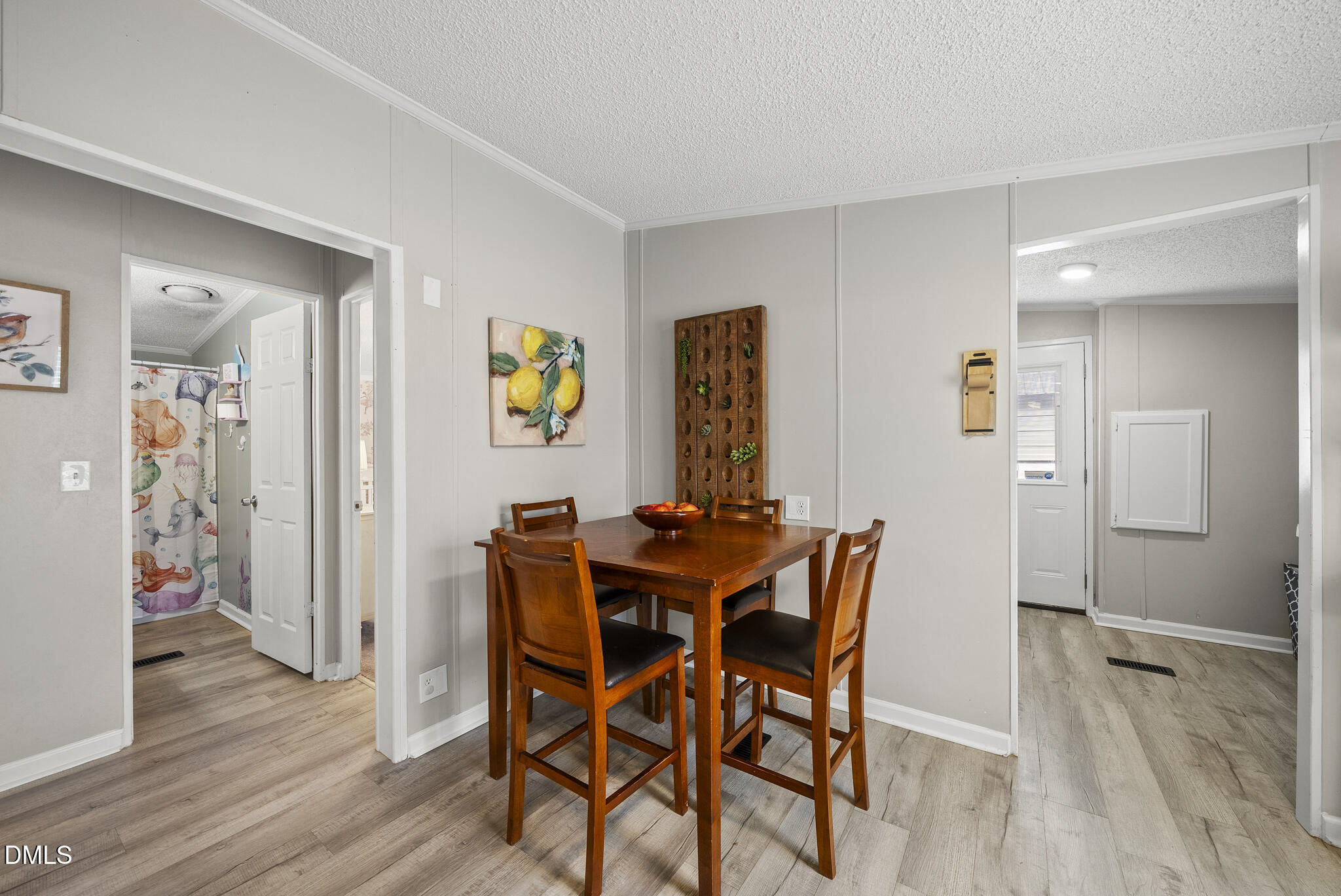 4703 Trinity Lane Rougemont, NC 27572 - Photo 25 of 55 a view of a dining room with furniture and wooden floor