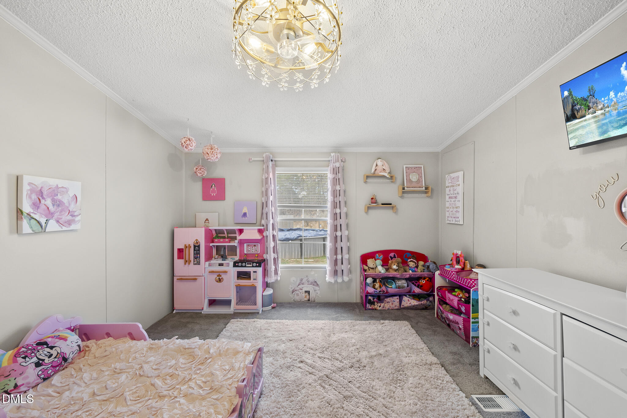 4703 Trinity Lane Rougemont, NC 27572 - Photo 29 of 55 a bedroom with furniture and a chandelier