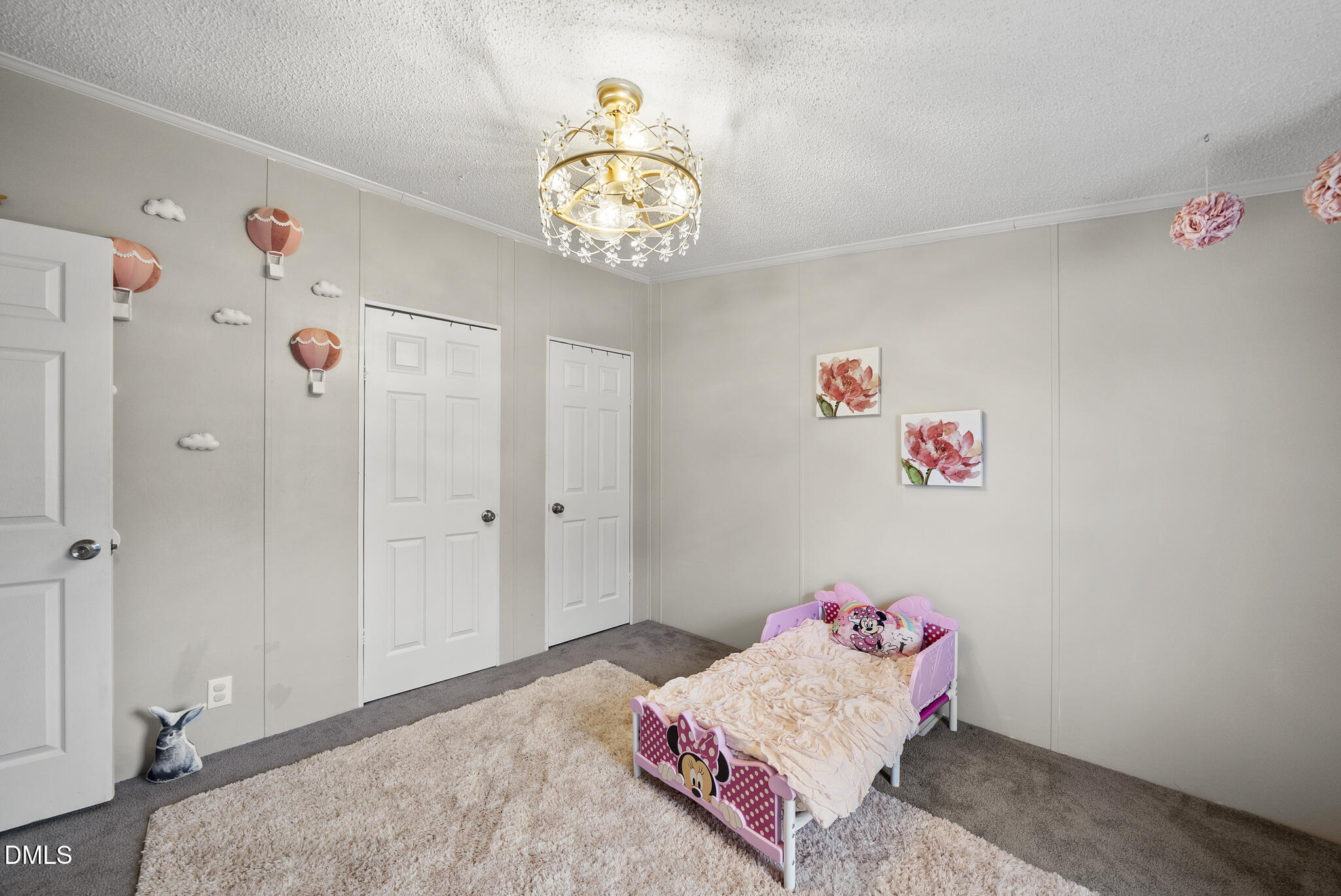 4703 Trinity Lane Rougemont, NC 27572 - Photo 30 of 55 a bedroom with a bed and a chandelier