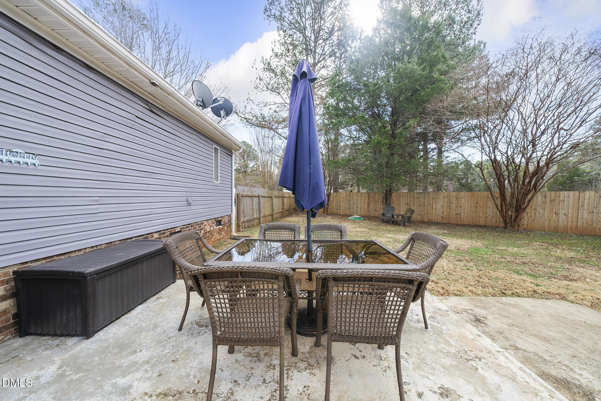 4703 Trinity Lane Rougemont, NC 27572 - Photo 38 of 55 a backyard of a house with table and chairs