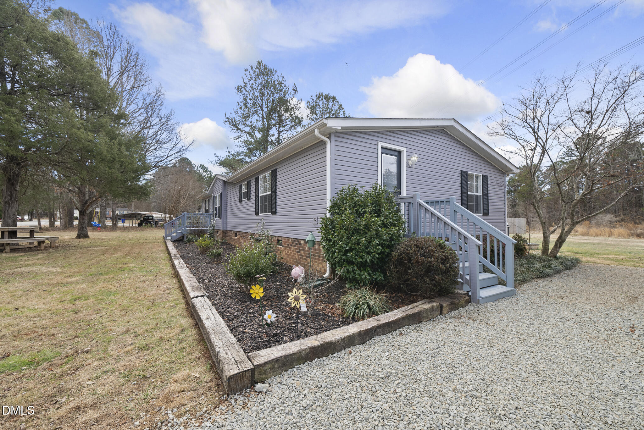 4703 Trinity Lane Rougemont, NC 27572 - Photo 50 of 55 a front view of a house with garden