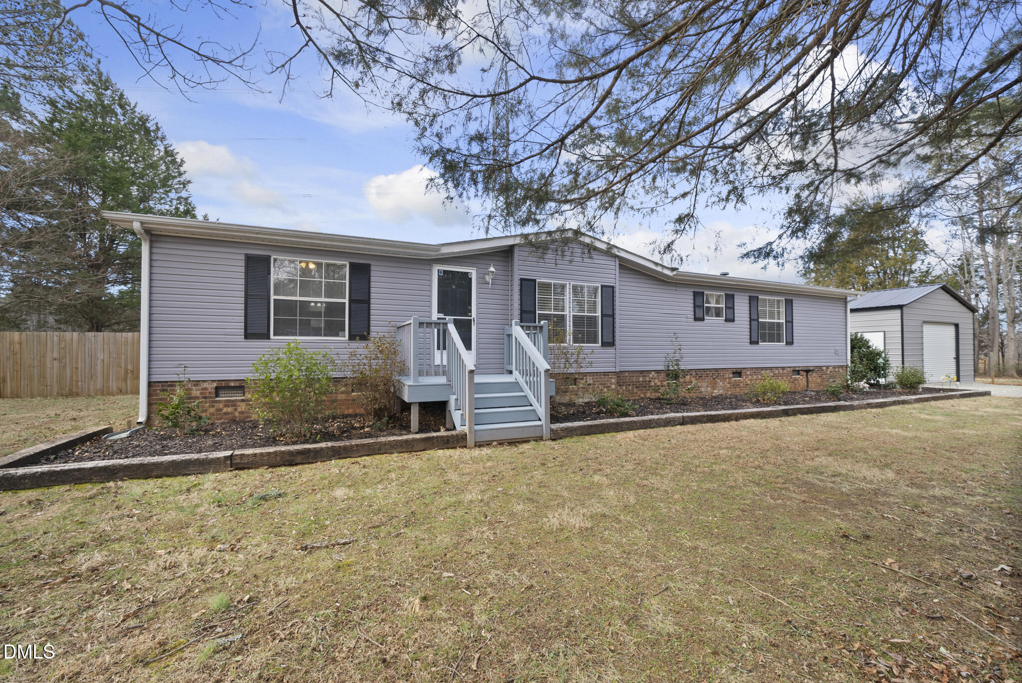 4703 Trinity Lane Rougemont, NC 27572 - Photo 51 of 55 a front view of house with yard and trees around
