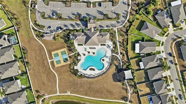 an aerial view of a house with outdoor space