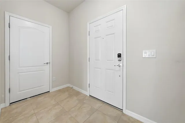 a kitchen with kitchen island granite countertop a sink and a stove top oven with wooden floor