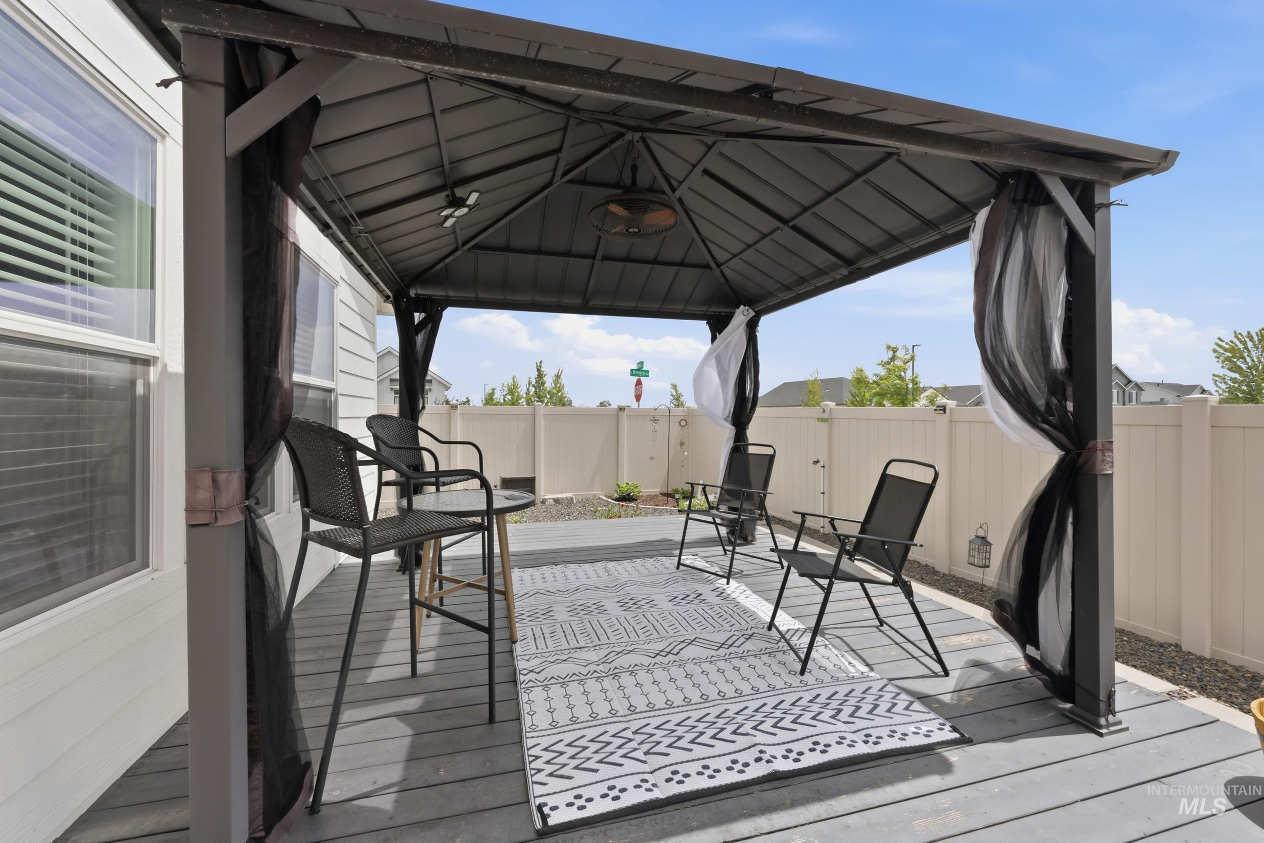 3665 W Lane Meridian, ID 83642 - Photo 31 of 42 Spacious outdoor deck featuring a dark grey wood-finish surface