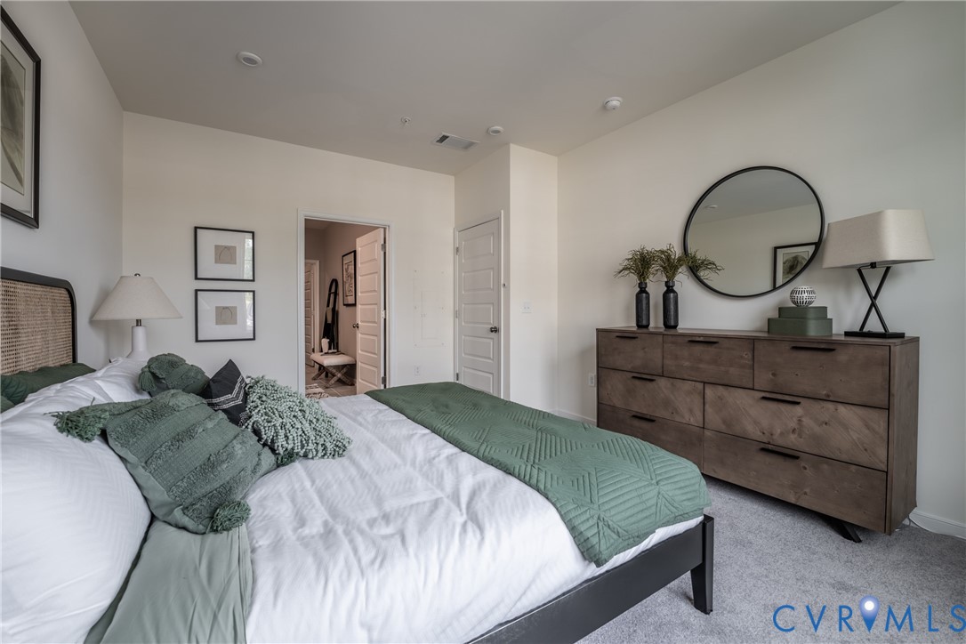4001 Next Level Trace Midlothian, VA 23112 - Photo 21 of 42 a bedroom with a bed and a dresser