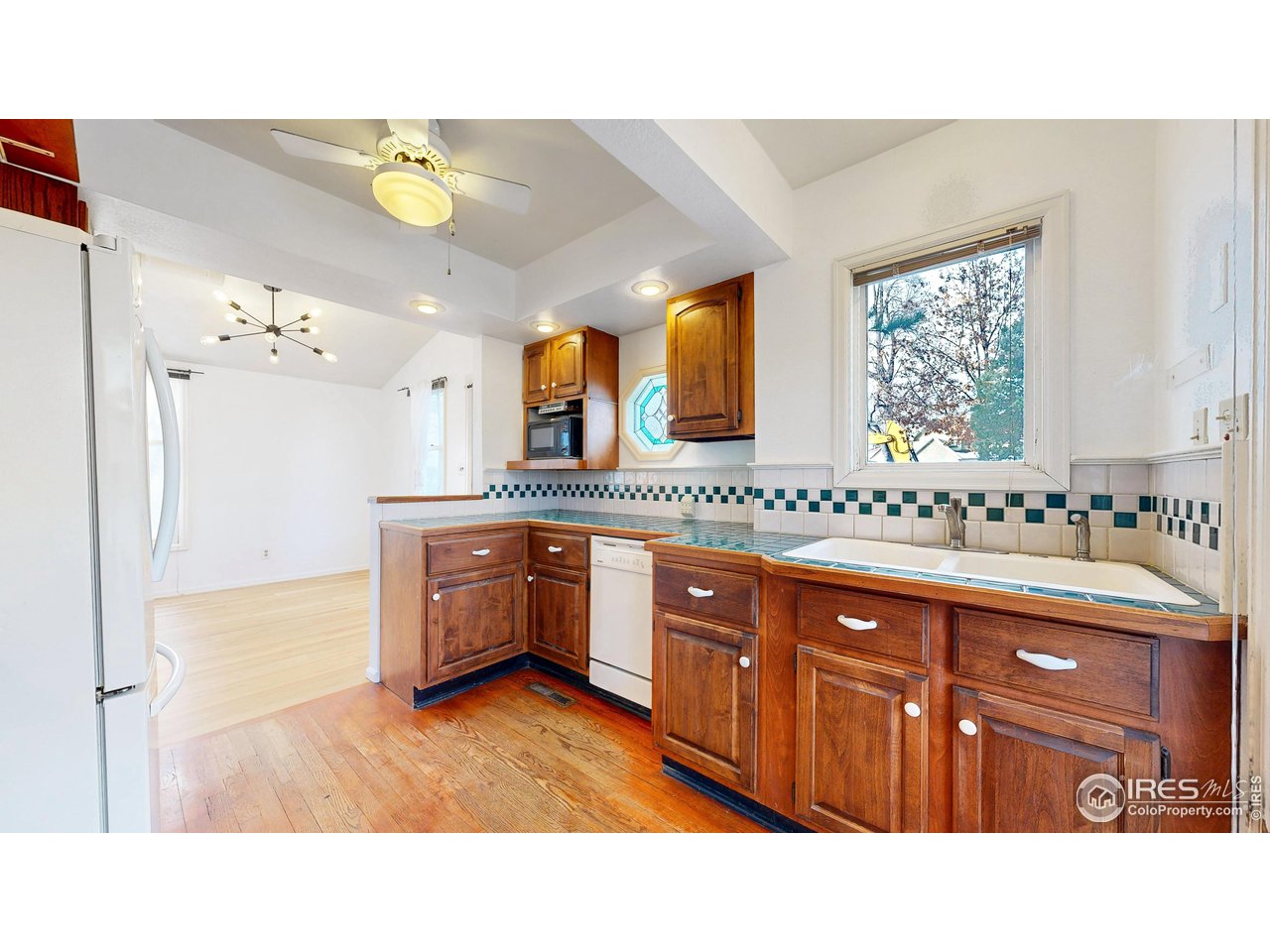 1035 West Oak Street Fort Collins, CO 80521 - Photo 12 of 50 a kitchen with sink and cabinets