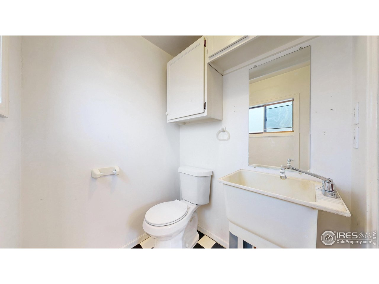 1035 West Oak Street Fort Collins, CO 80521 - Photo 15 of 50 a bathroom with a sink a toilet and mirror