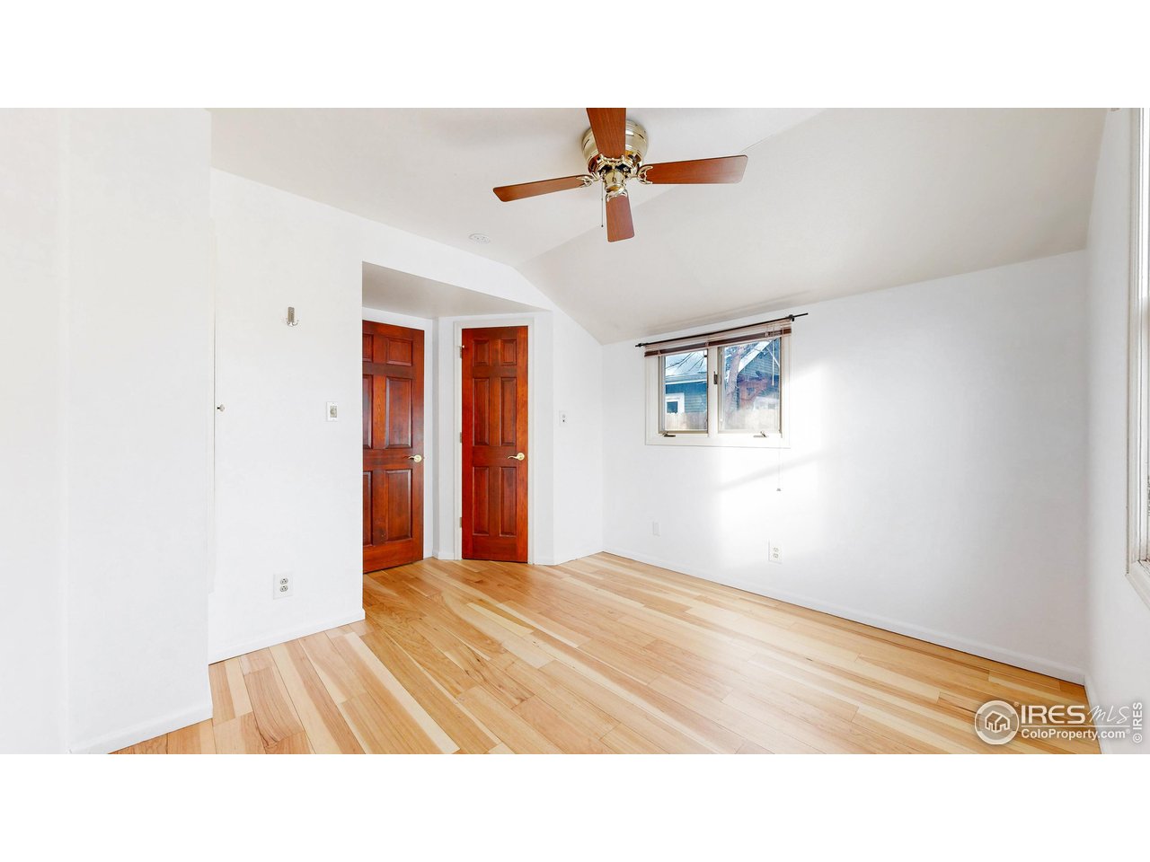 1035 West Oak Street Fort Collins, CO 80521 - Photo 17 of 50 a picture of a room with a ceiling fan
