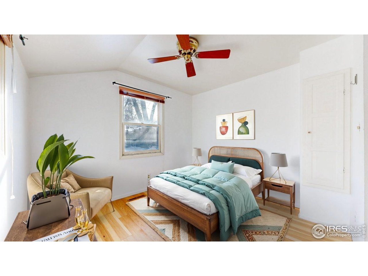 1035 West Oak Street Fort Collins, CO 80521 - Photo 18 of 50 a bedroom with a bed and wooden floor