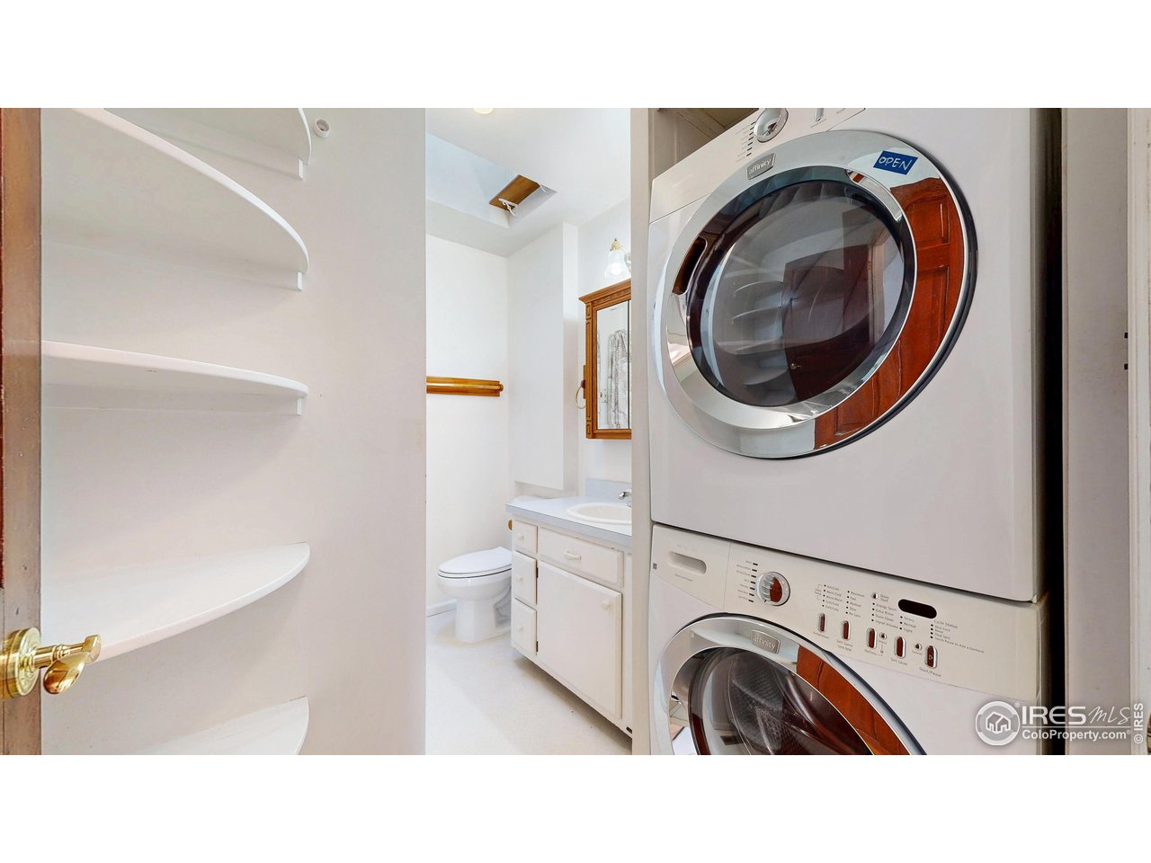 1035 West Oak Street Fort Collins, CO 80521 - Photo 23 of 50 a en suite bathroom with a sink and a mirror