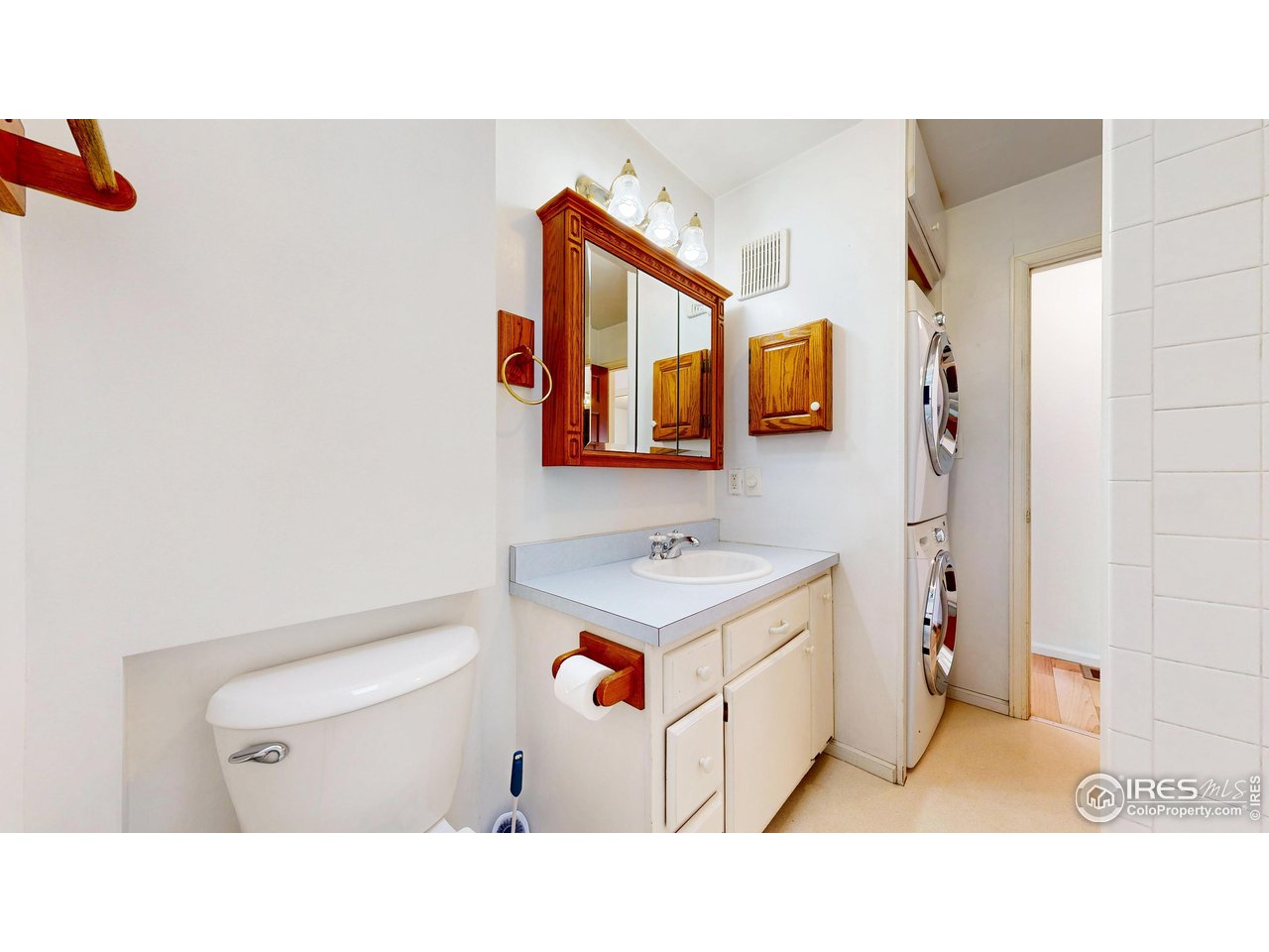 1035 West Oak Street Fort Collins, CO 80521 - Photo 25 of 50 a bathroom with a sink a mirror and a toilet
