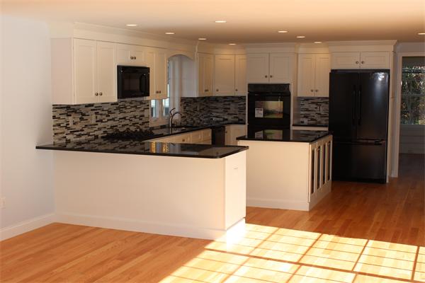 190 Baldwin Road Billerica, MA 01821 - Photo 11 of 30 a kitchen with stainless steel appliances granite countertop a refrigerator and a stove top oven