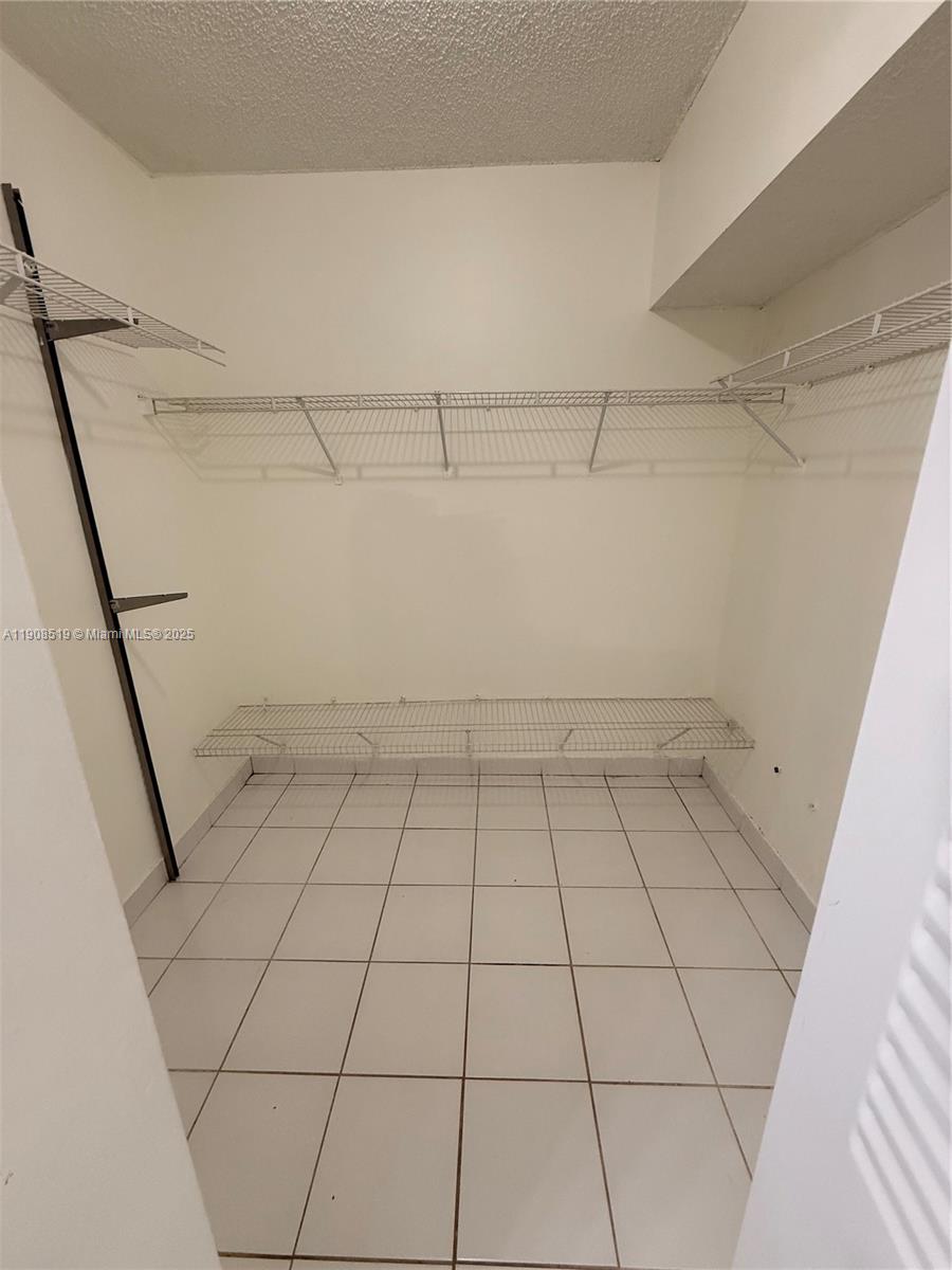 6300 Southwest 138th Court, Unit 102 Miami, FL 33183 - Photo 11 of 17 a view of a room with white tiles