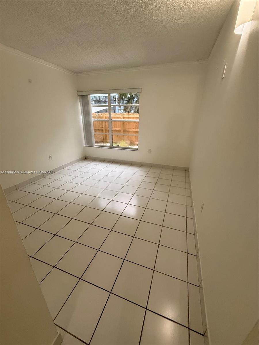 6300 Southwest 138th Court, Unit 102 Miami, FL 33183 - Photo 15 of 17 a view of an empty room and a window