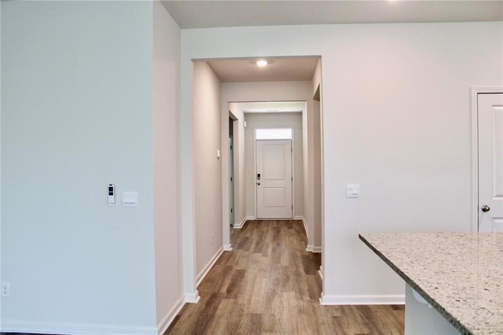102 Fremont Lane Pooler, GA 31322 - Photo 2 of 10 a view of a hallway with wooden floor