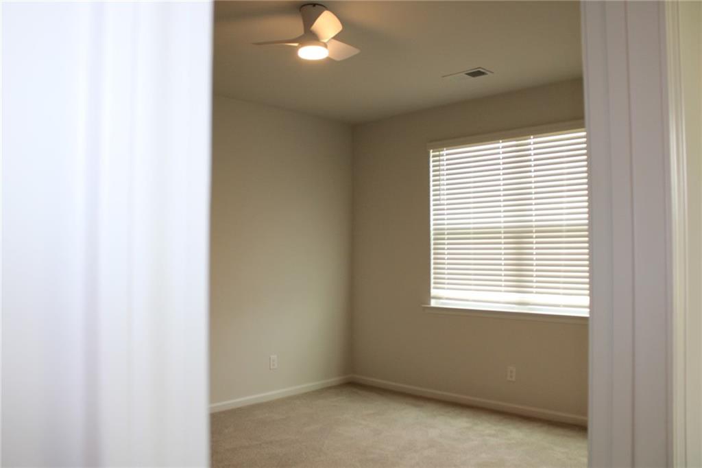 102 Fremont Lane Pooler, GA 31322 - Photo 6 of 10 a view of an empty room with a window