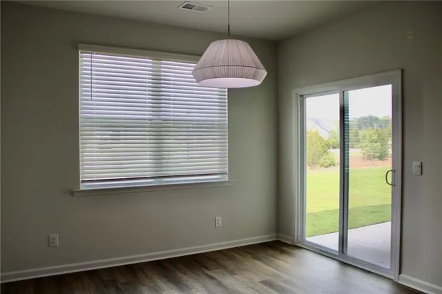 a room that has a window and wooden floor